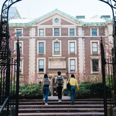 Students walking around a university campus